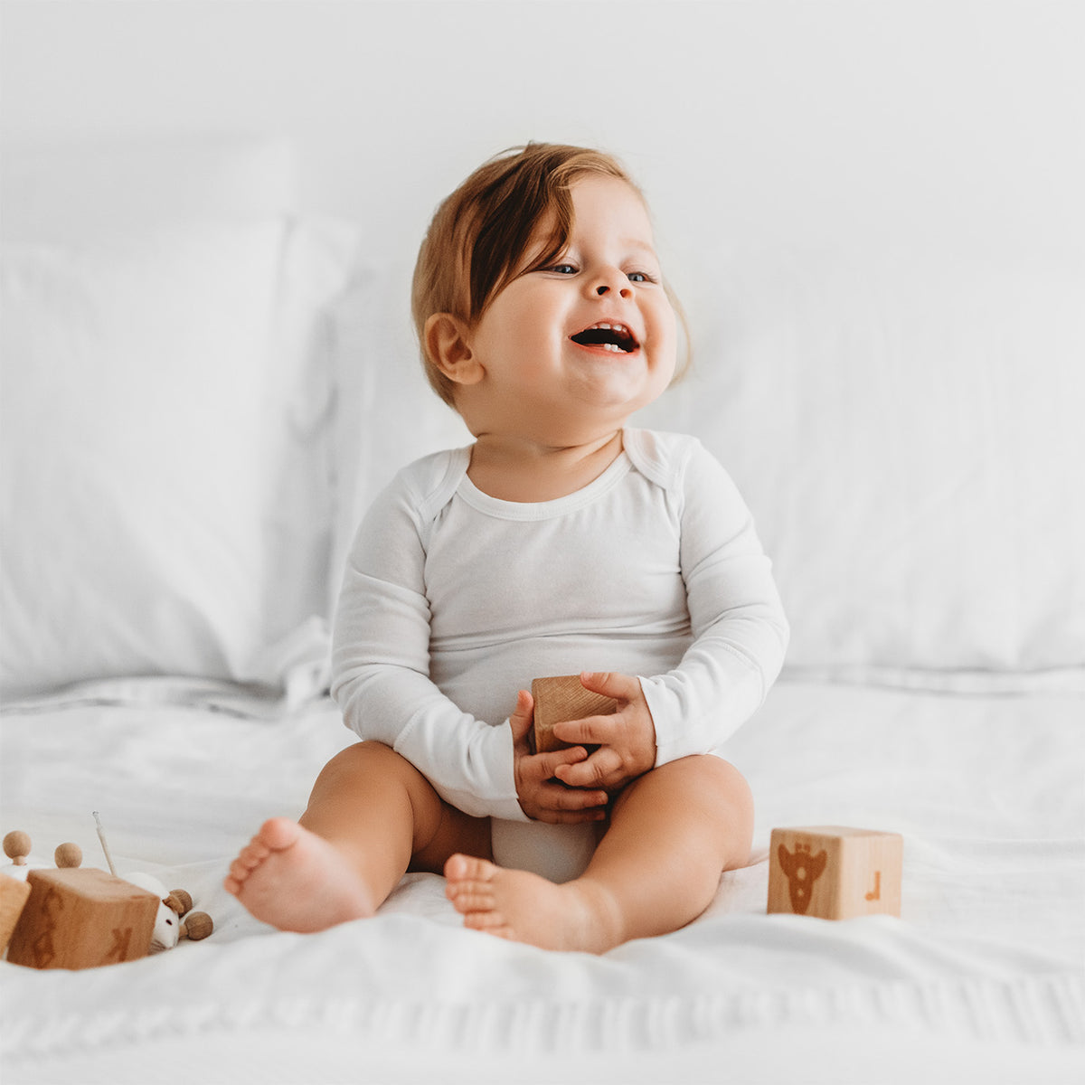 HappySkin® Baby Bodysuit with foldaway mittens